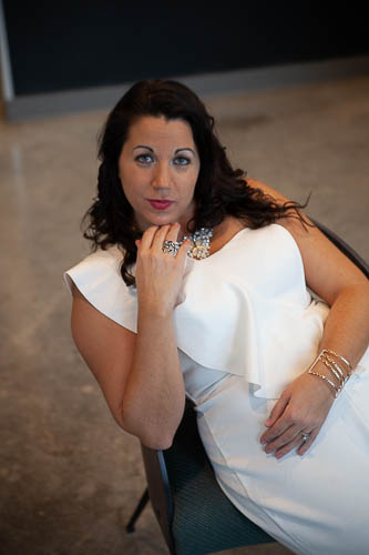 Woman looking at camera wearing white shirt and statement necklace
what to wear for branding photos https://sarahmadras.com