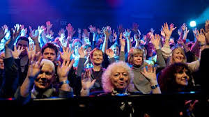 image of audience waving hands